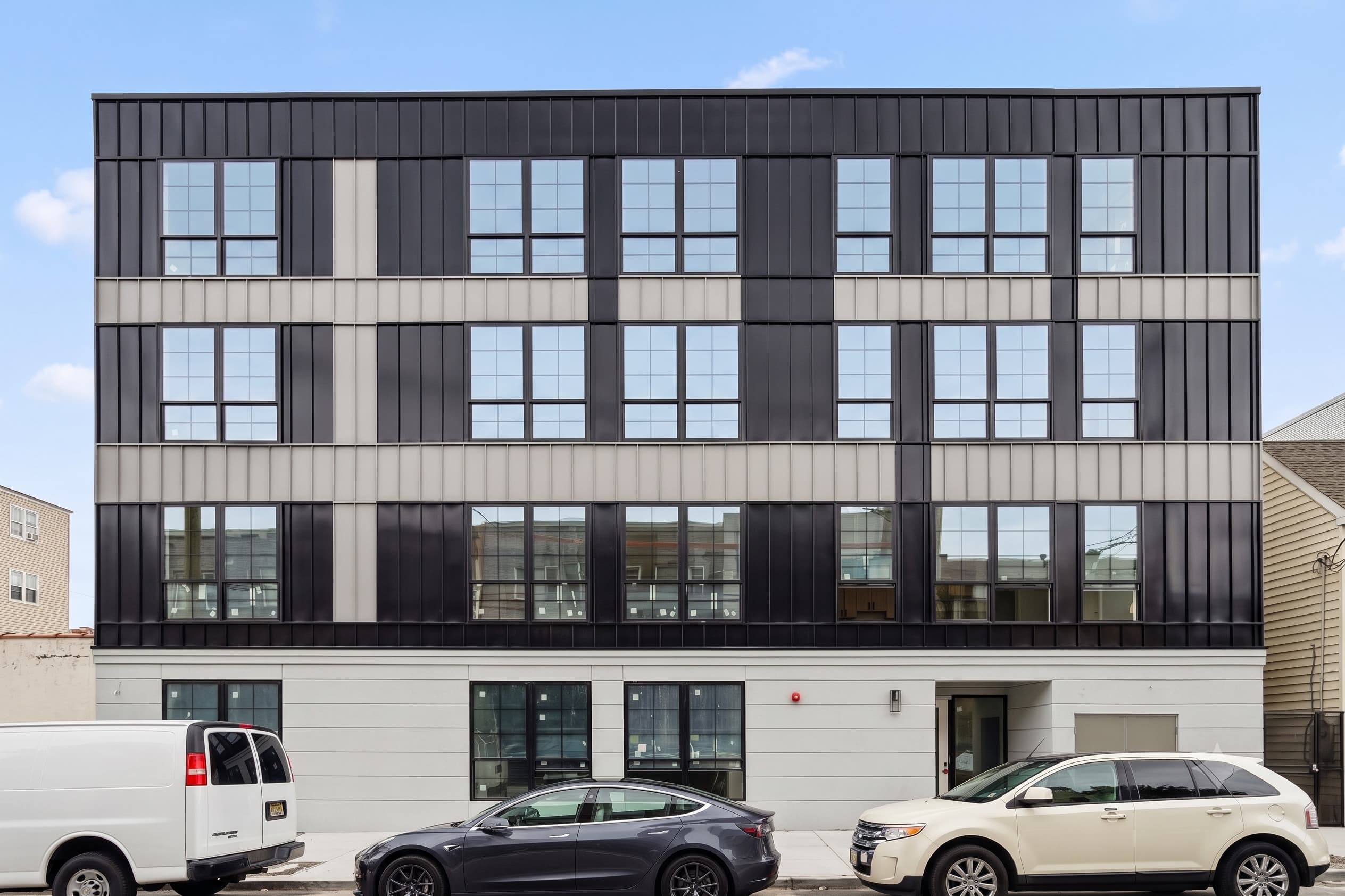 Architectural exterior of Novum Apartments at dusk